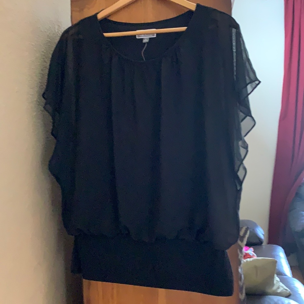 Ladies black blouse with flowing shirt sleeves.